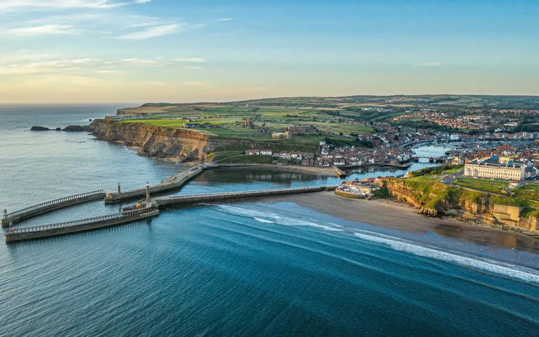 The sun rises over Whitby harbour, North Yorkshire